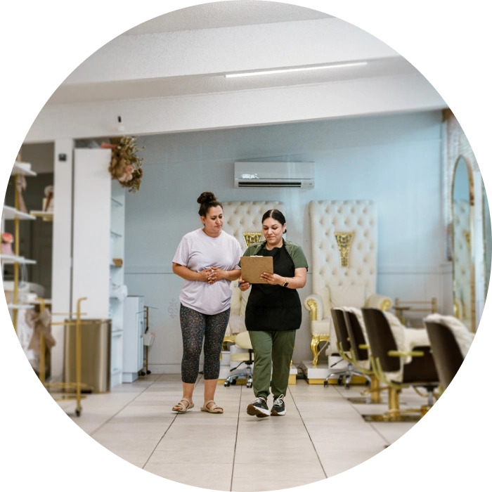 Salon interior with two women talking