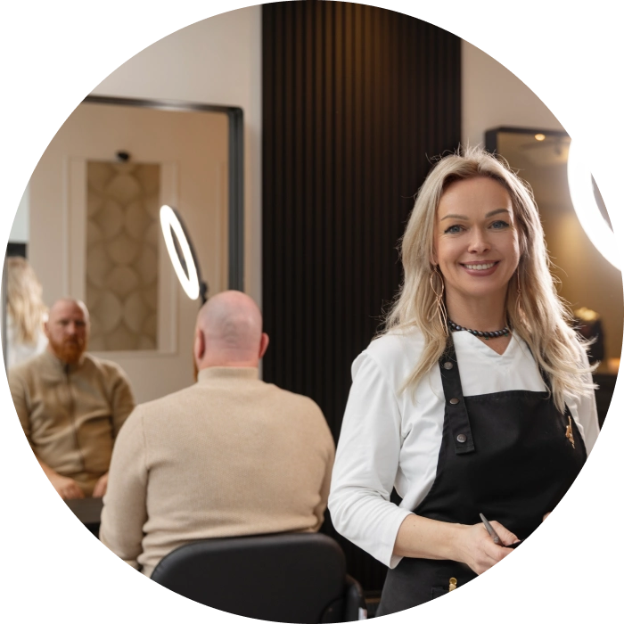 Hairdresser smiling in modern salon