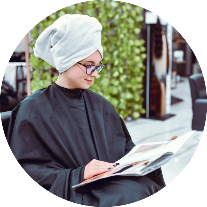 Relaxing in salon with towel on head